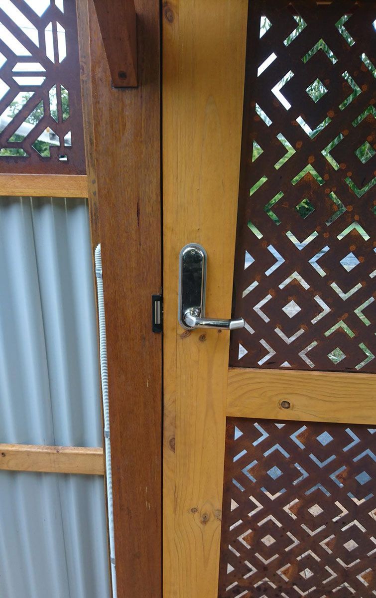 A Wooden See Through Door With A Silver Metal Door Knob Having A Handle — Ontime Locksmiths & Security In Mullumbimby, NSW