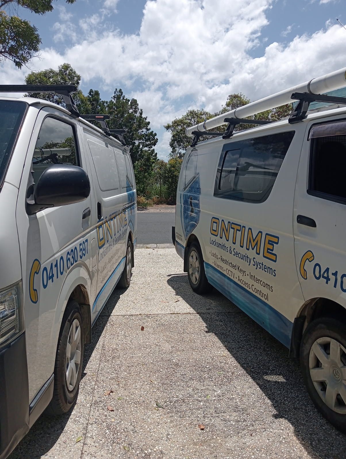 Two People Are Working On A Door With A Screwdriver — Ontime Locksmiths & Security In Mullumbimby, NSW