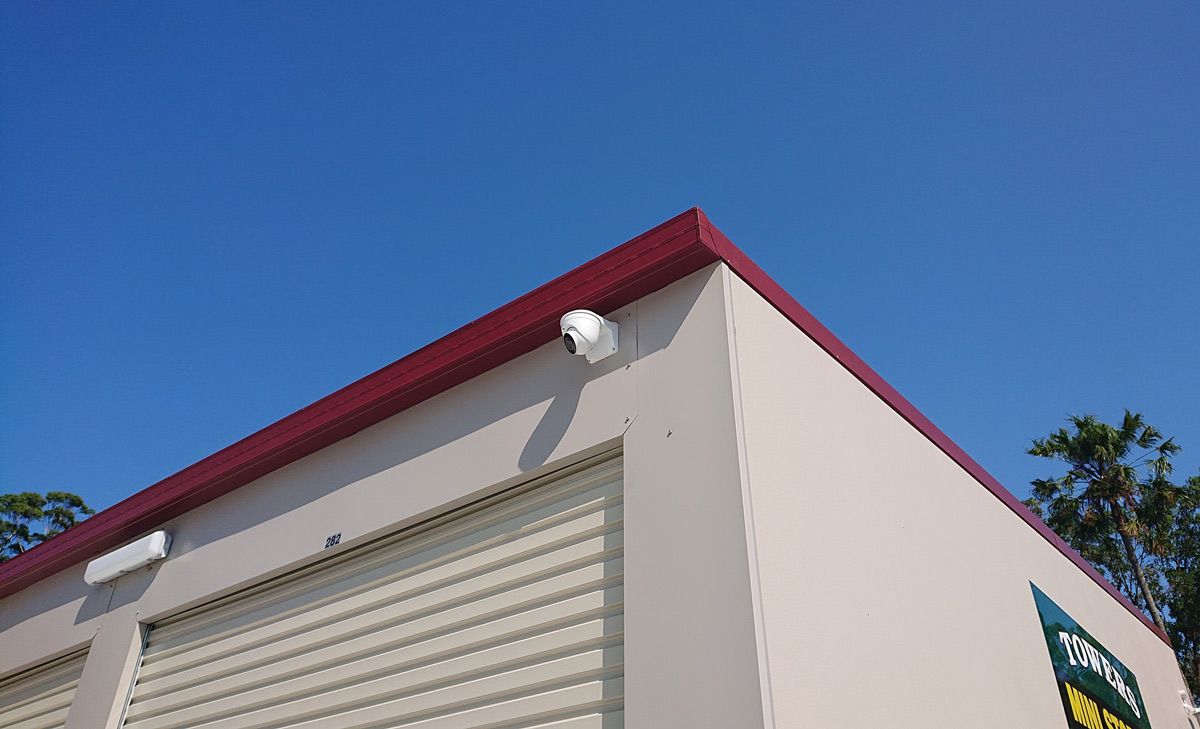 CCTV Camera Attached On The Top Corner Of Building — Ontime Locksmiths & Security In Mullumbimby, NSW