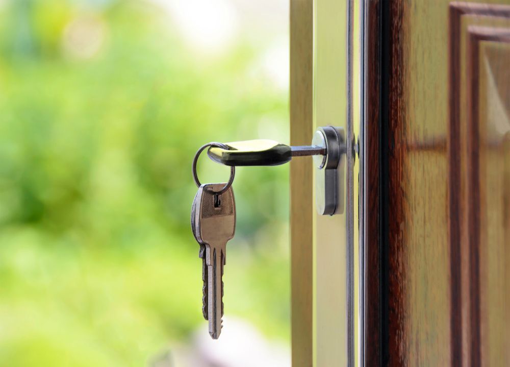 Three Keys Hanging In A Door Lock, One Of It Inserted In Door Lock — Ontime Locksmiths & Security In Mullumbimby, NSW