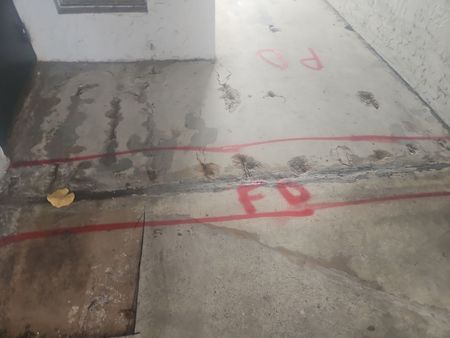 A concrete floor with the word fd painted on it.