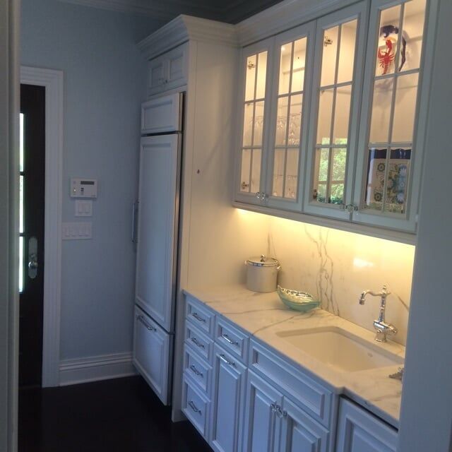 Side View of White Kitchen Cabinets — South Amboy, NJ — WoodSmith Cabinet & Architectural Woodwork Co.