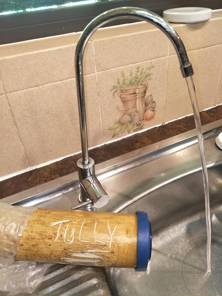 A Filter With The Word Tully Written On It In A Sink Next To A Faucet — Cairns Clear Water Company In Douglas Shire, QLD