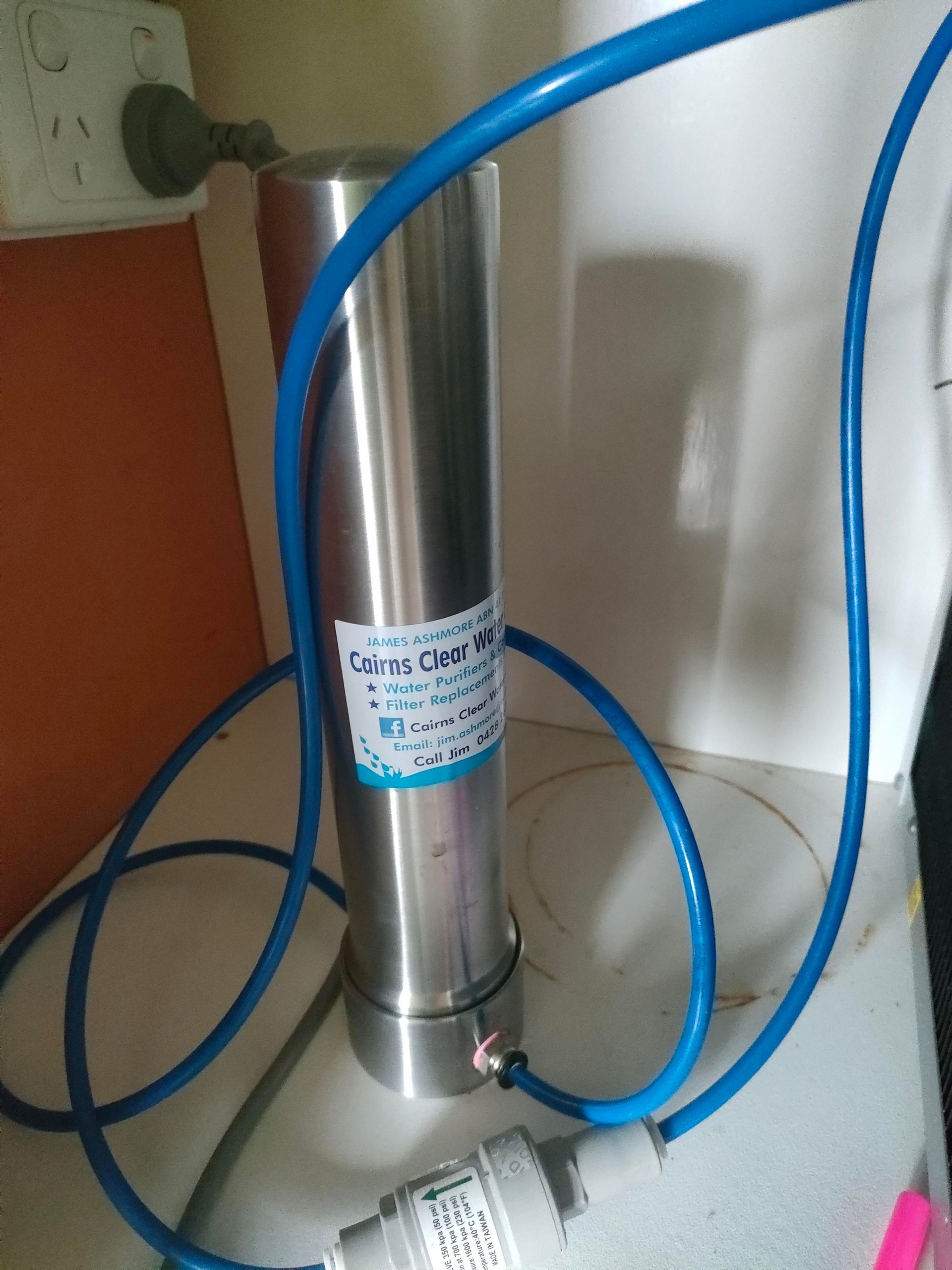 A Chrome Water Filter With A Hose Attached To It — Cairns Clear Water Company In Westcourt, QLD