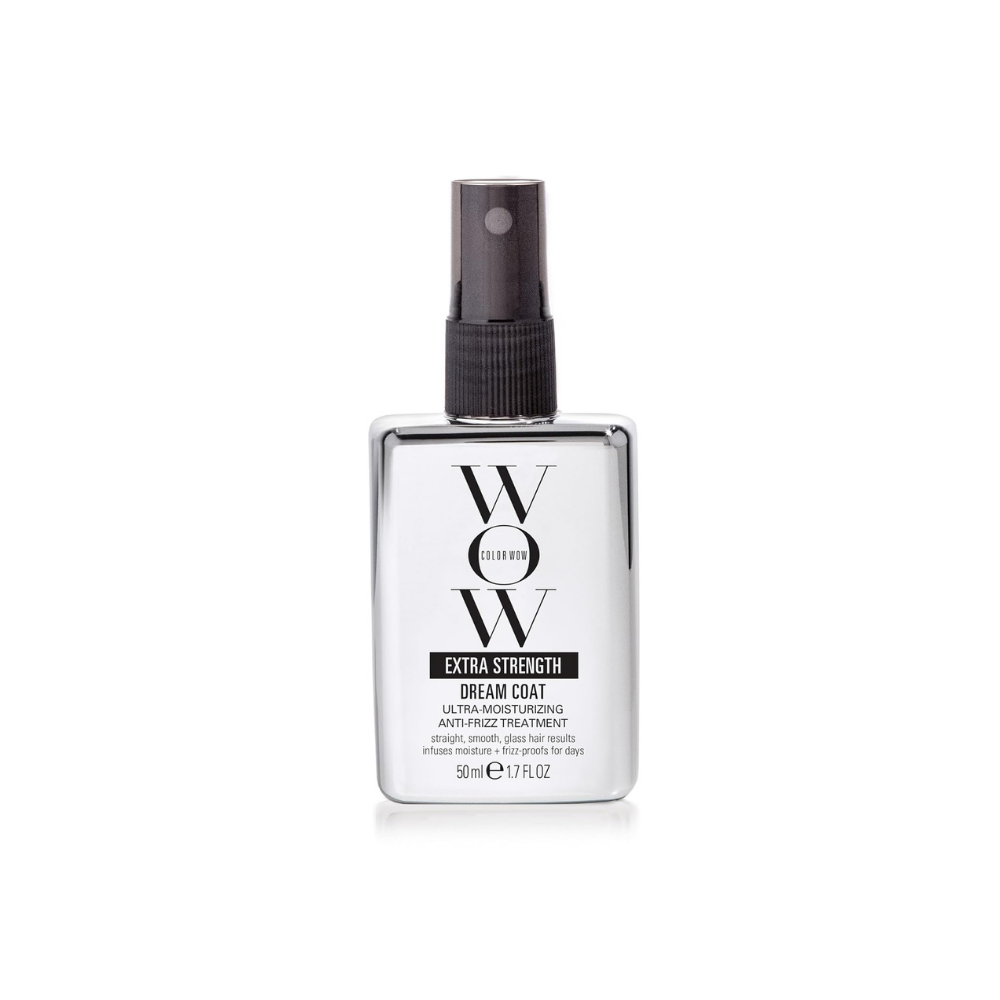 White bottle of hair care spray with dark cap and large “WOW” label on the front.