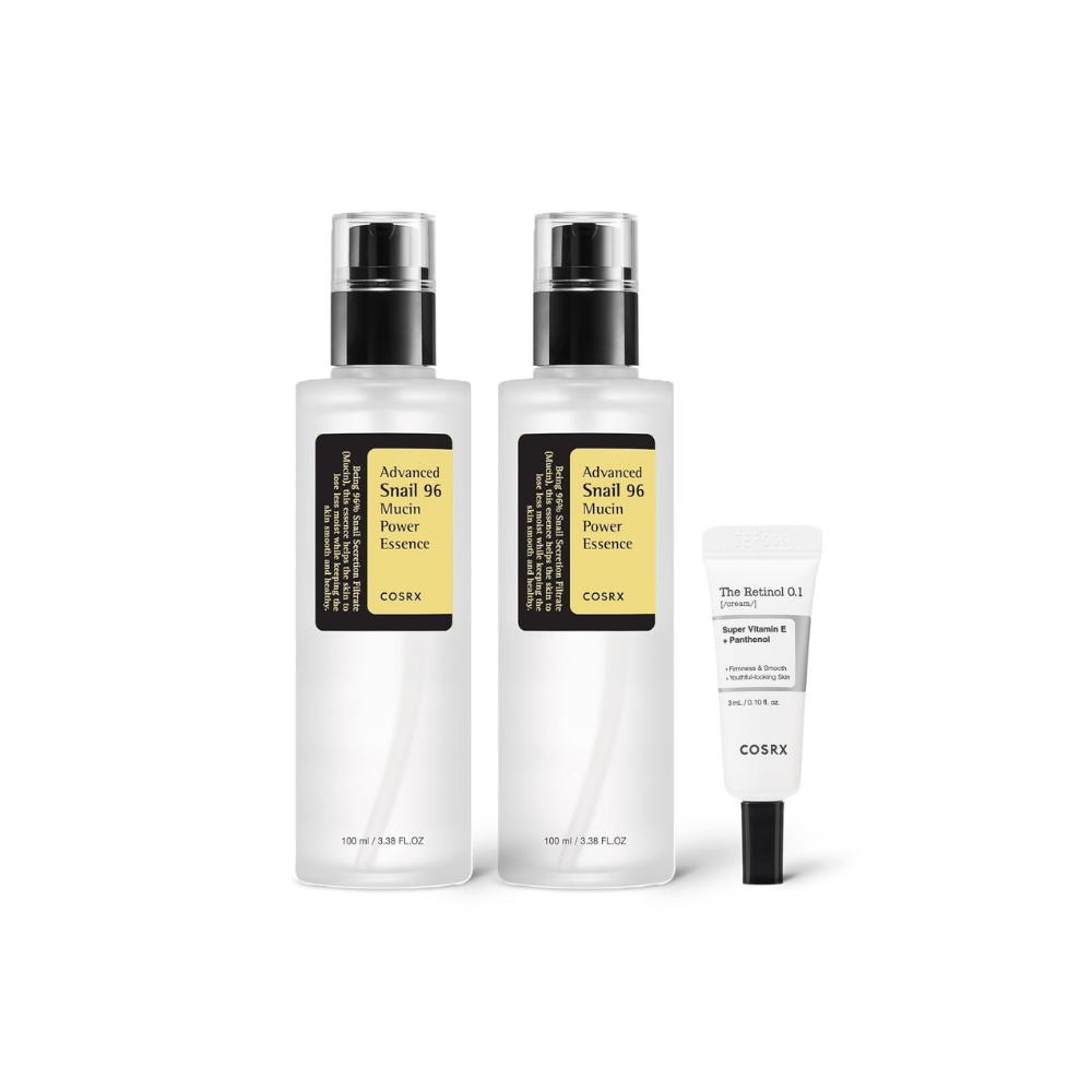 Two white pump bottles and one small tube of skincare products on a white background