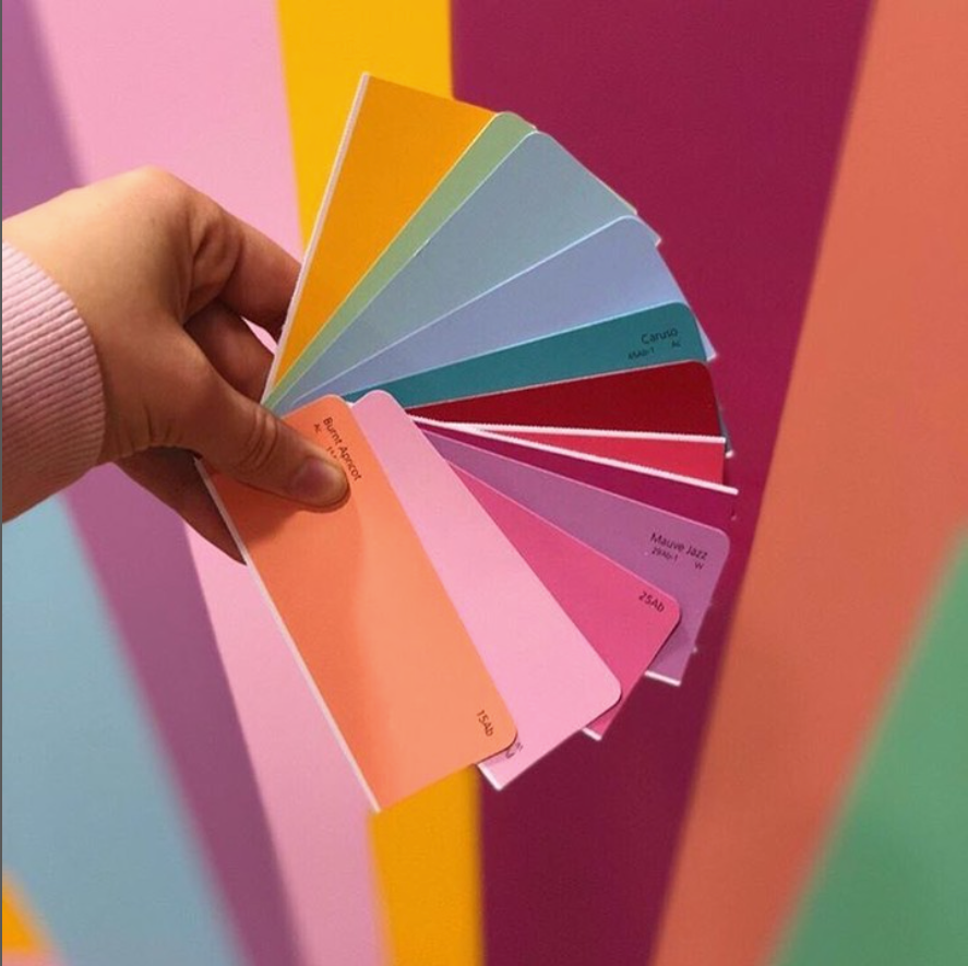 A Person is Holding a Magnifying Glass Over a Piece of Paper - Paint Shop in  Fyshwick, ACT