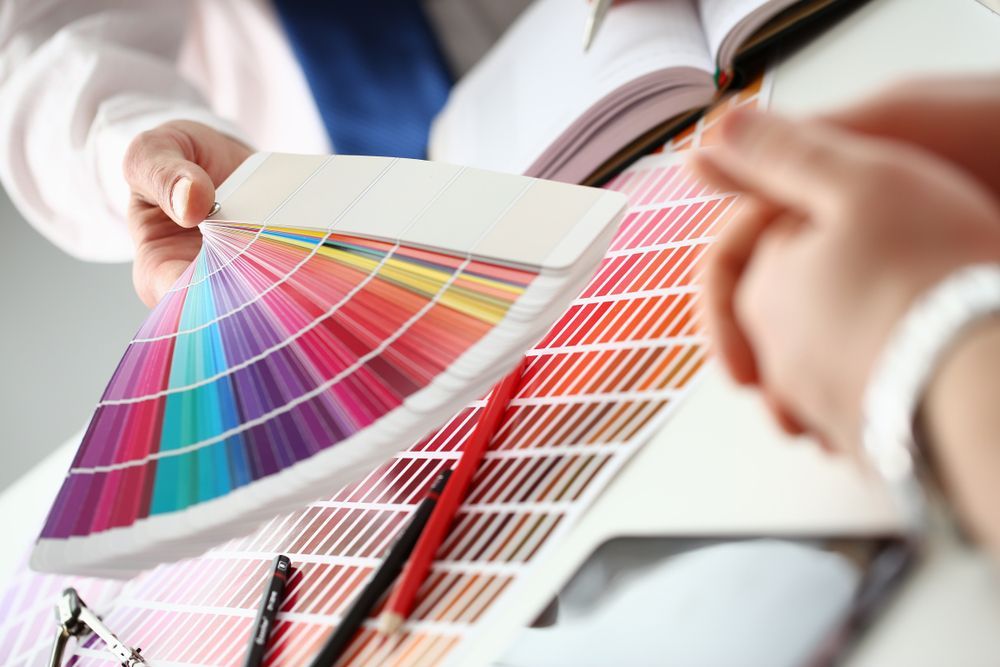 A Person is Holding a Palette of Colors in Their Hands - Paint Shop in  Fyshwick, ACT