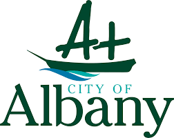 The logo for the city of albany has a boat on it.