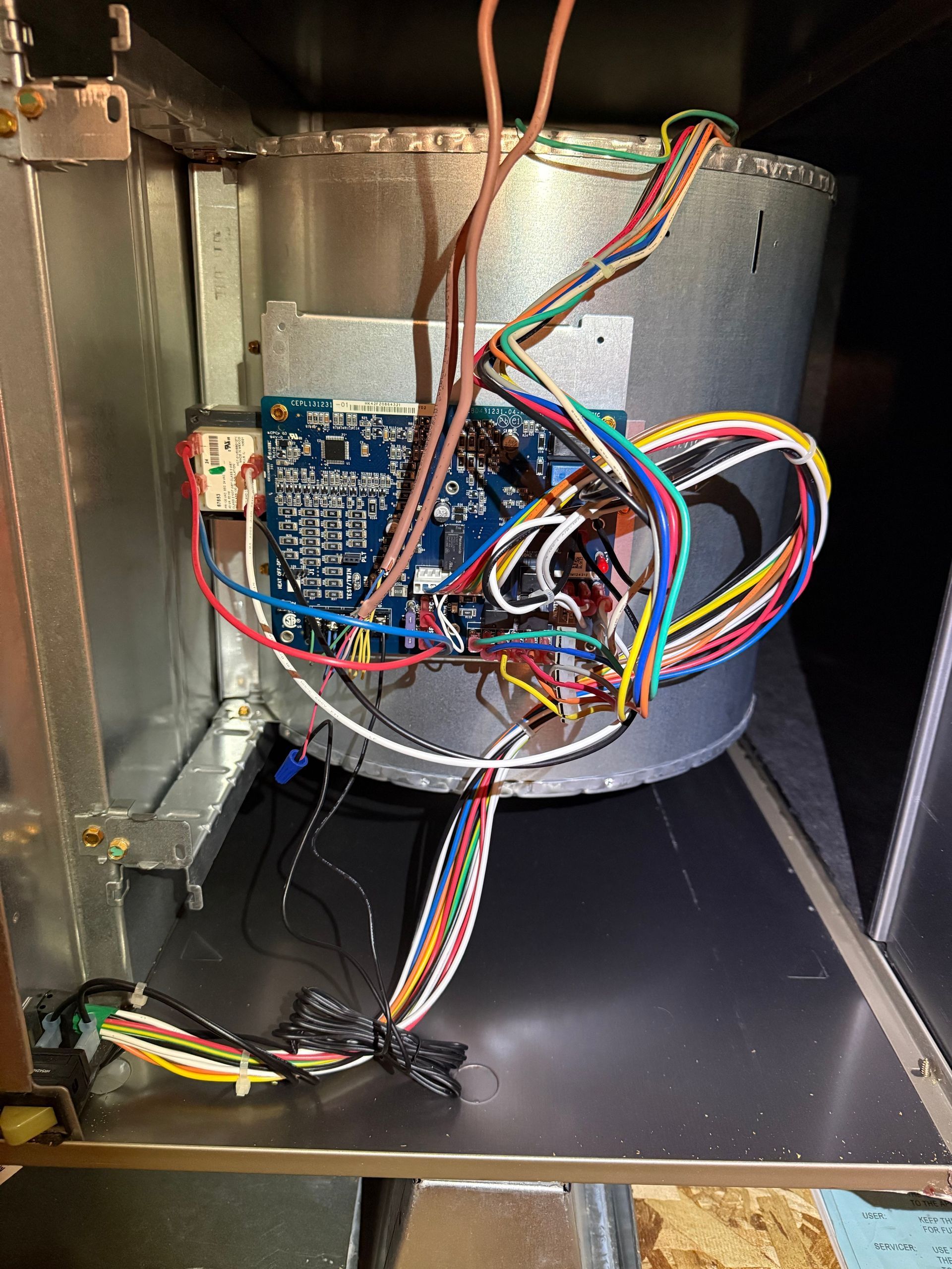 Internal AC component being serviced as part of a professional tune-up