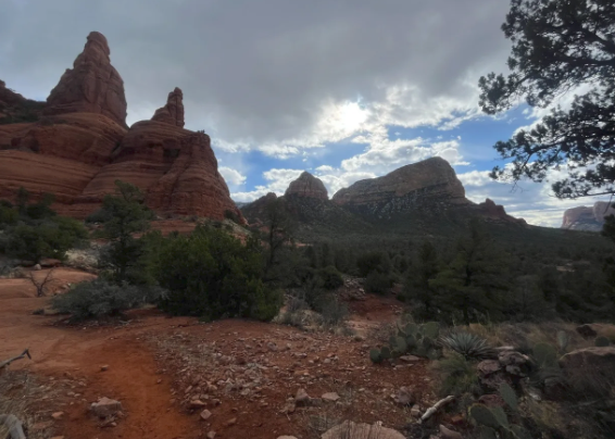 A blurred image of a desert landscape with mountains in the background