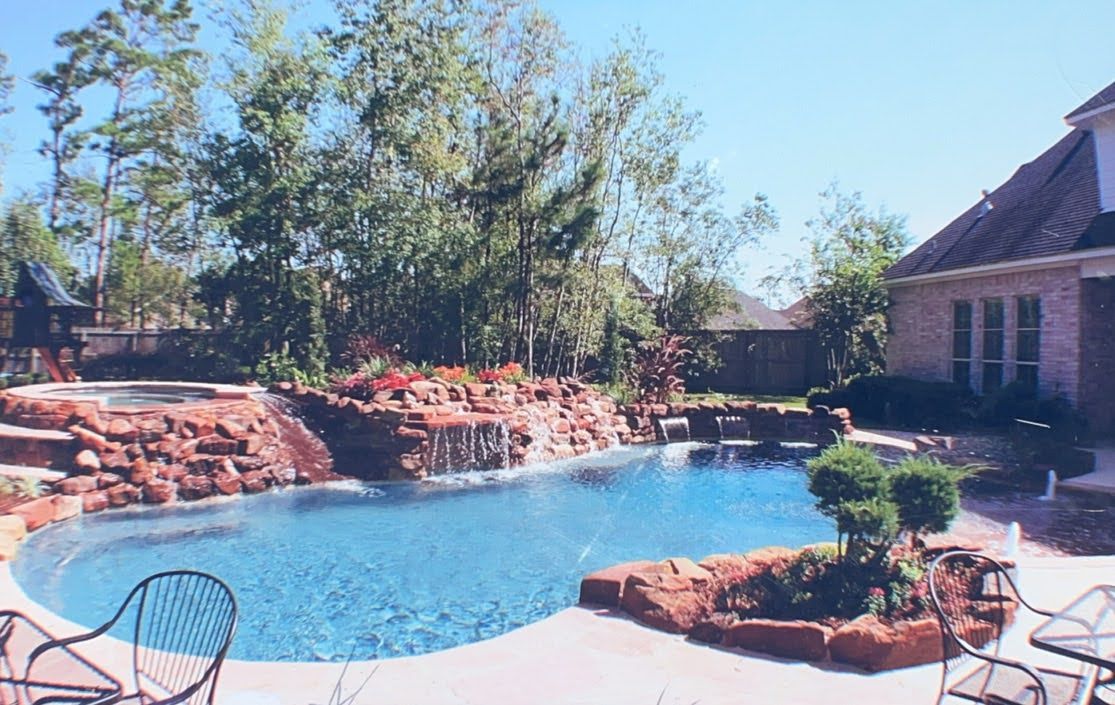 A large swimming pool in the backyard of a house