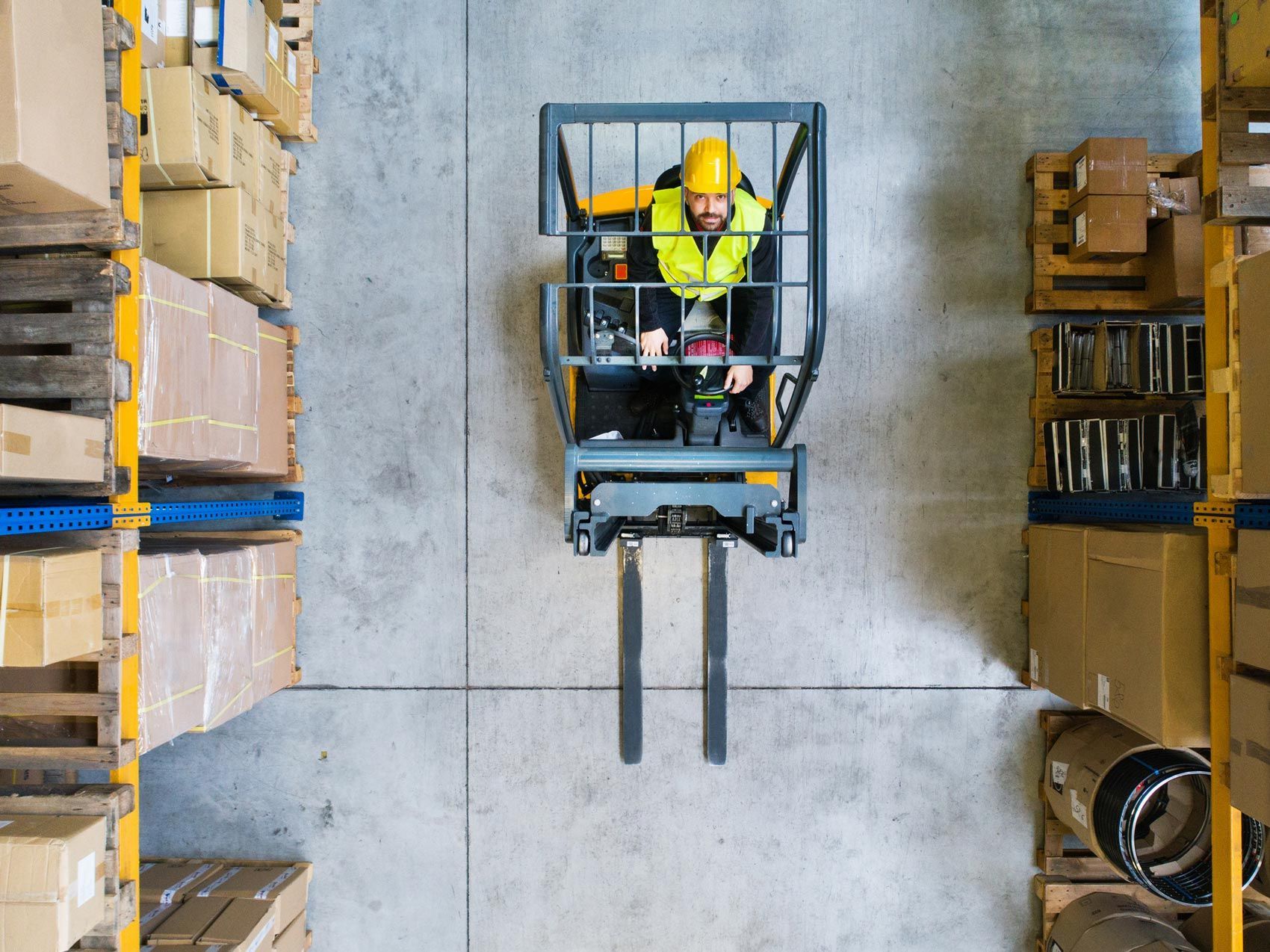 Man forklift driver working in a warehouse