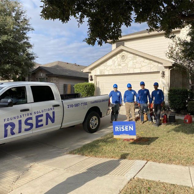 Risen team in front of house - San Antonio, TX - Risen Foundation Solutions