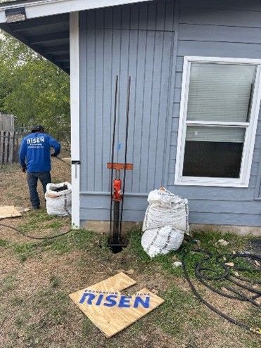 A man is performing foundation repair. A man is performing foundation repair.