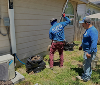 Two men of Risen Foundation Solutions are working on a foundation repair. Two men of Risen Foundation Solutions are working on a foundation repair.