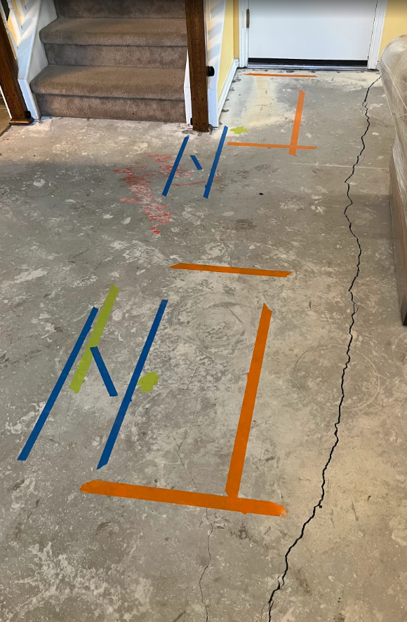 A floor featuring blue and orange lines arranged in a dynamic pattern.