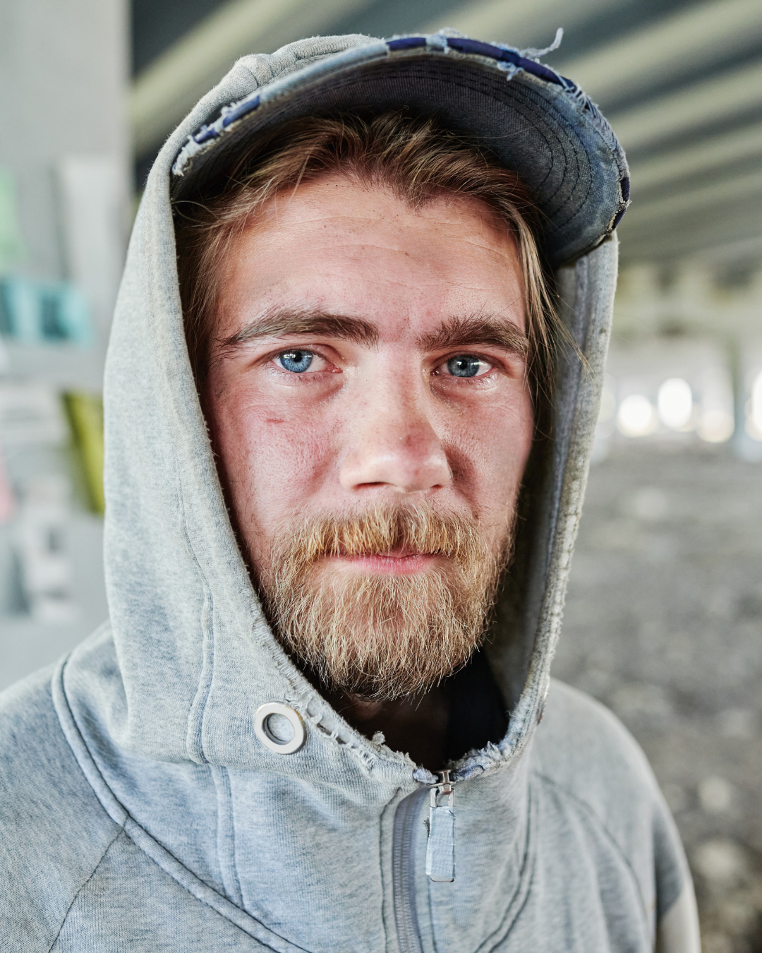 A man in a warehouse with a quote from austin