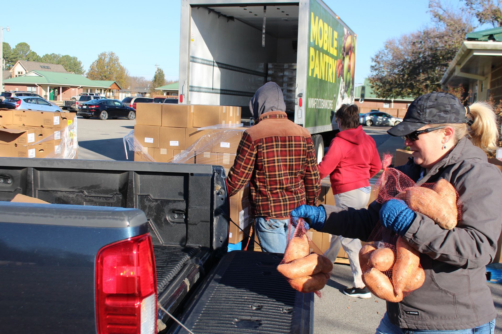 NWAFB volunteers load boxes into red truck