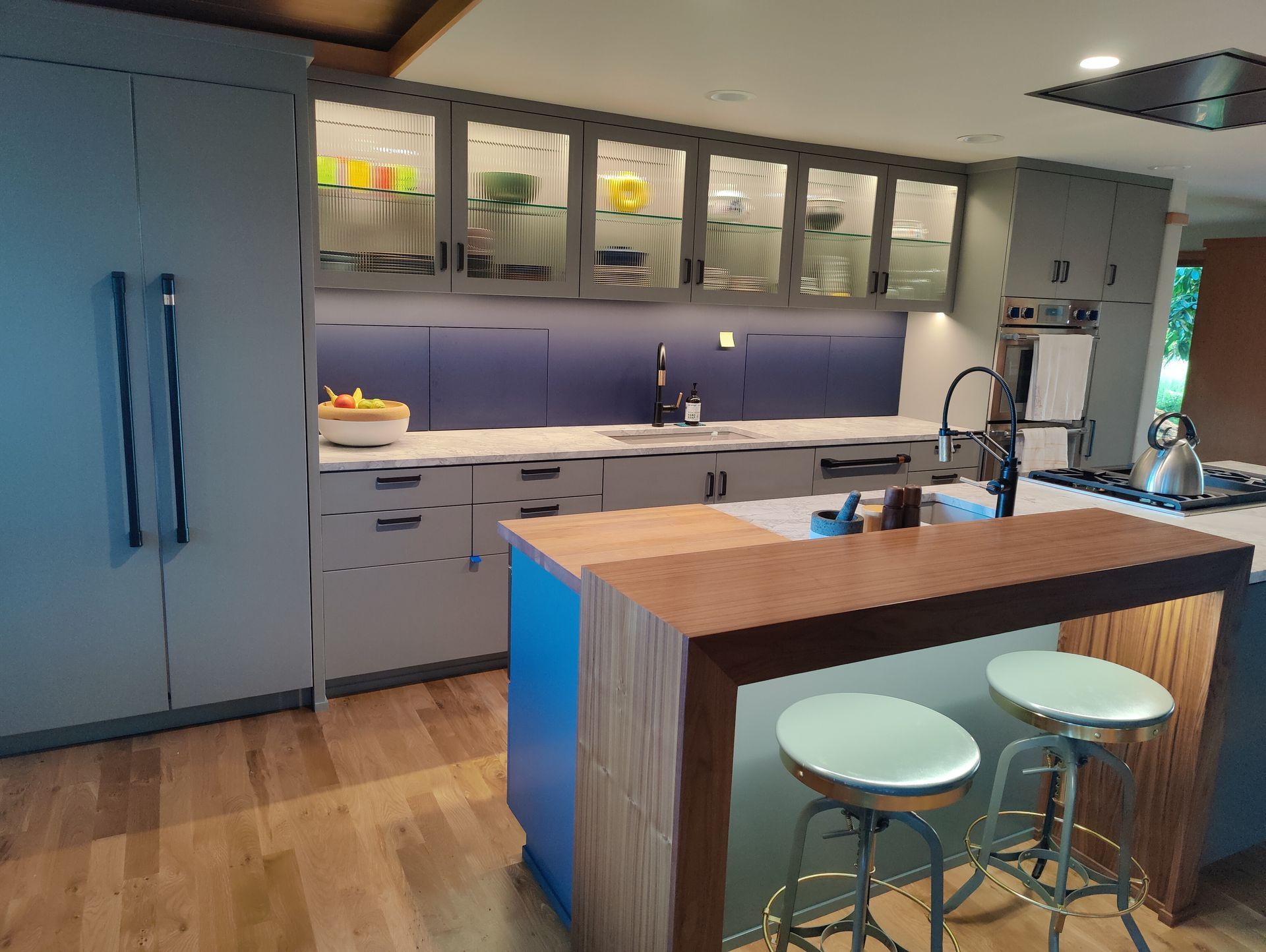 Man measuring a wooden wall with a tape measure outdoors