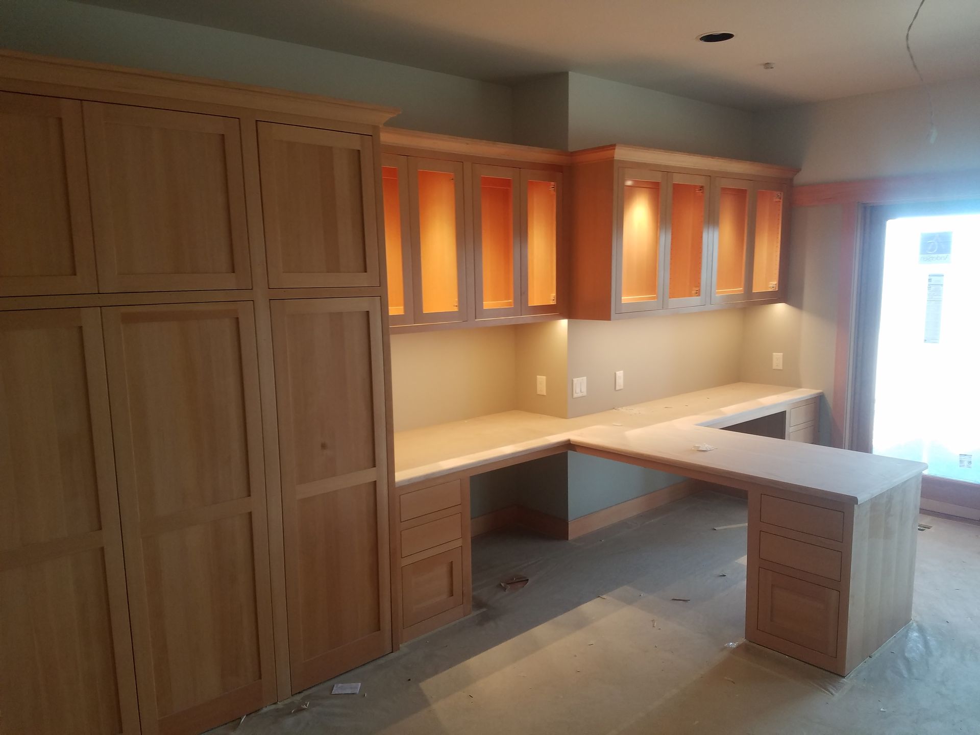 Cozy home library with a desk, chair, and large bookshelves filled with books