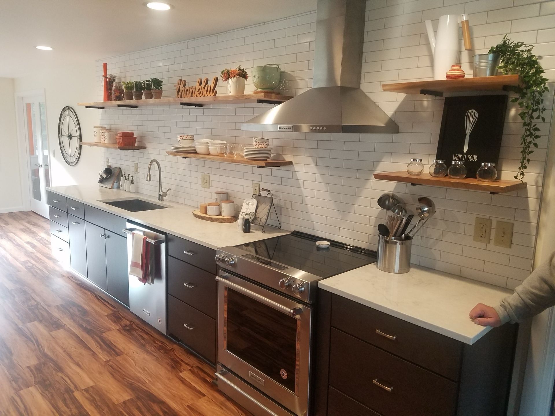 Dark brown wood bathroom vanity with a marble countertop