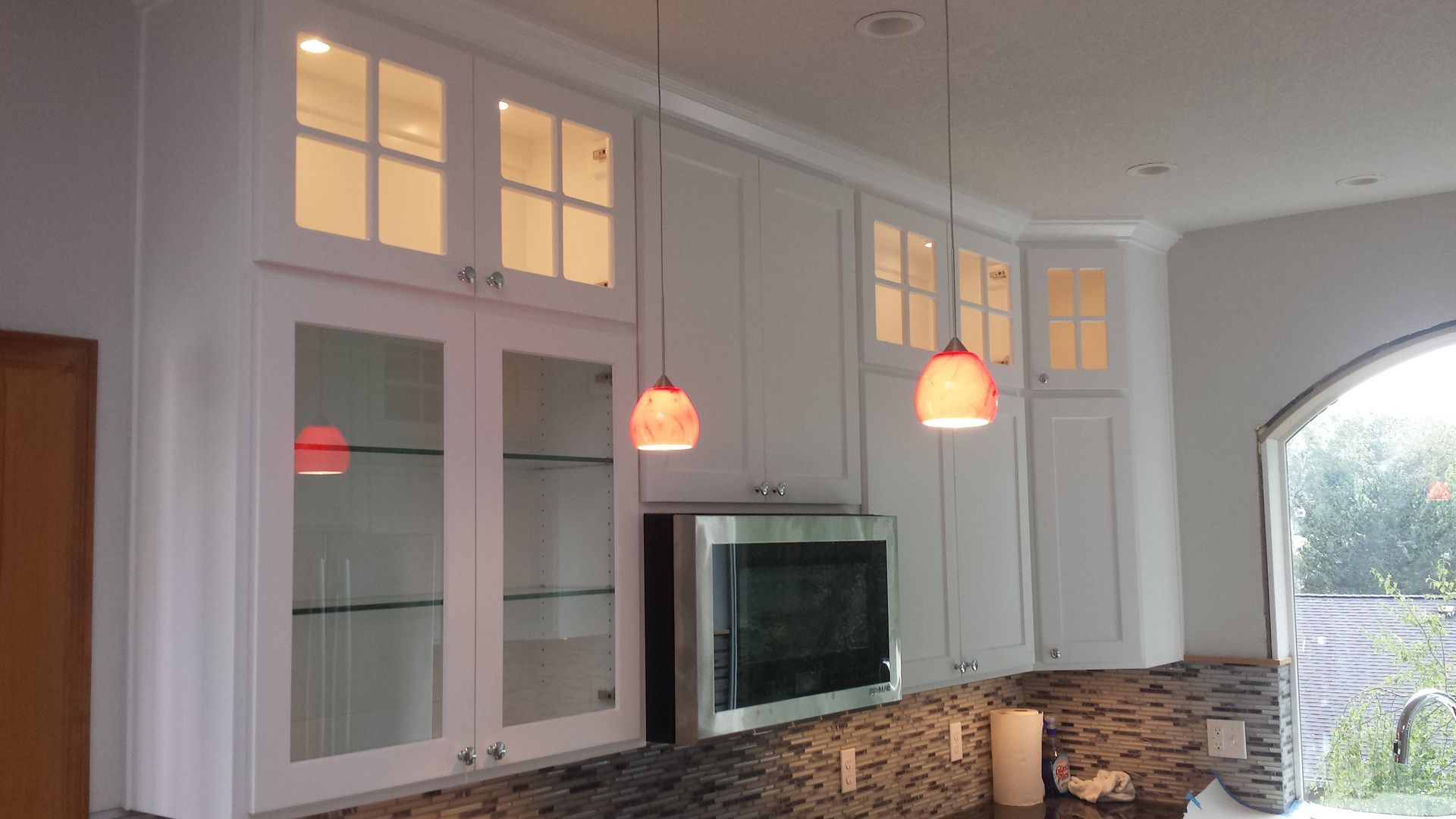 U-shaped kitchen with light wood cabinets