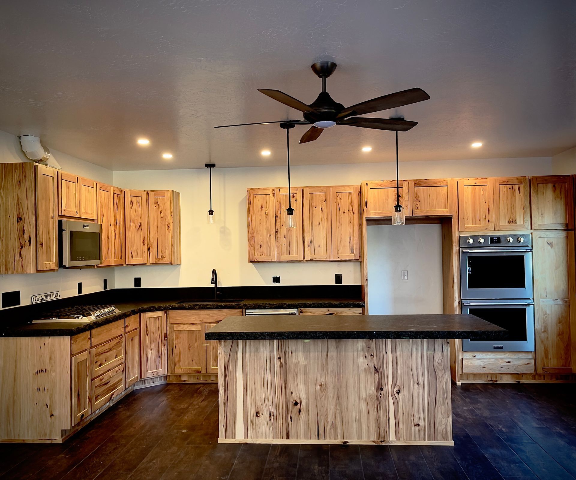 Modern kitchen with light wood cabinets and stainless steel appliances Modern kitchen with light wood cabinets and stainless steel appliances