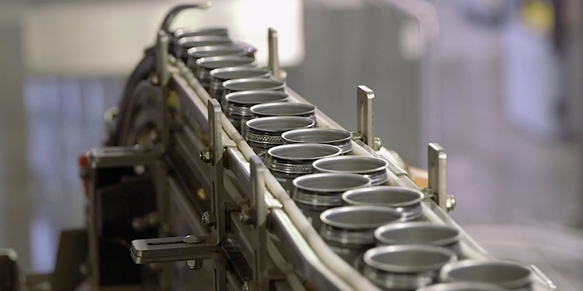 Photo of beer cans ready to be filled on canning line