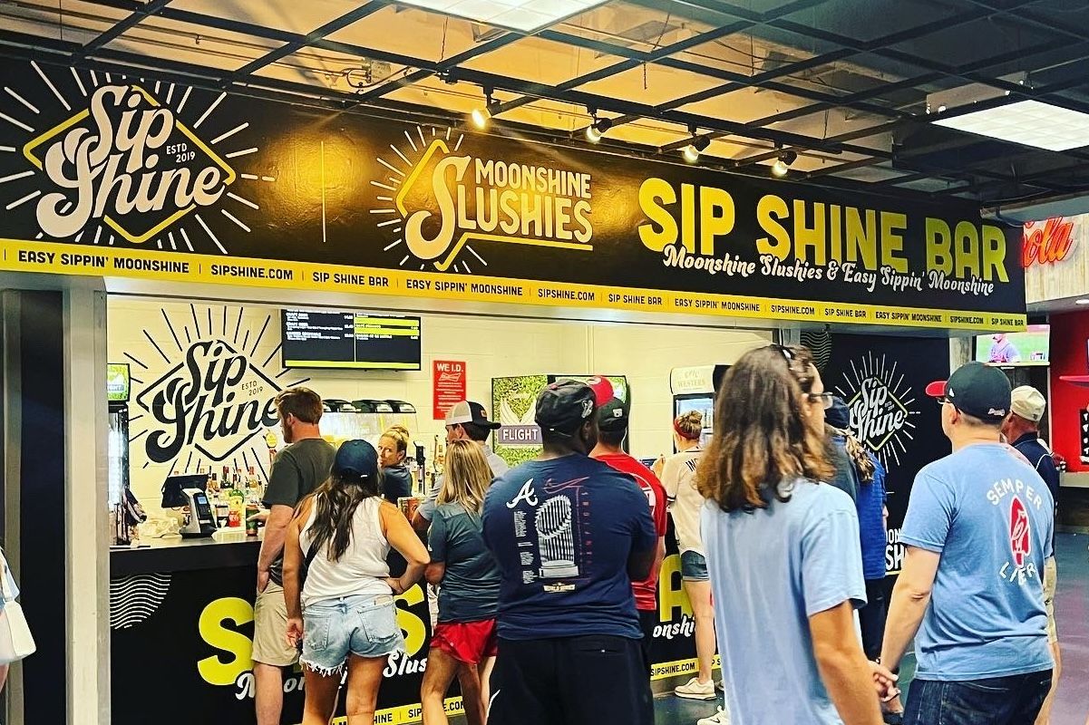 Fans in line at the SipShine Moonshine Bar during a Tampa Bay Rays game