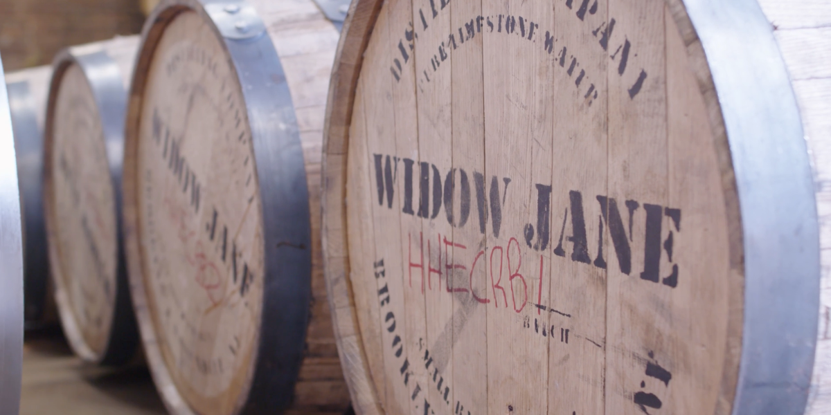 A picture of Widow Jane bourbon barrels laid on their side. 