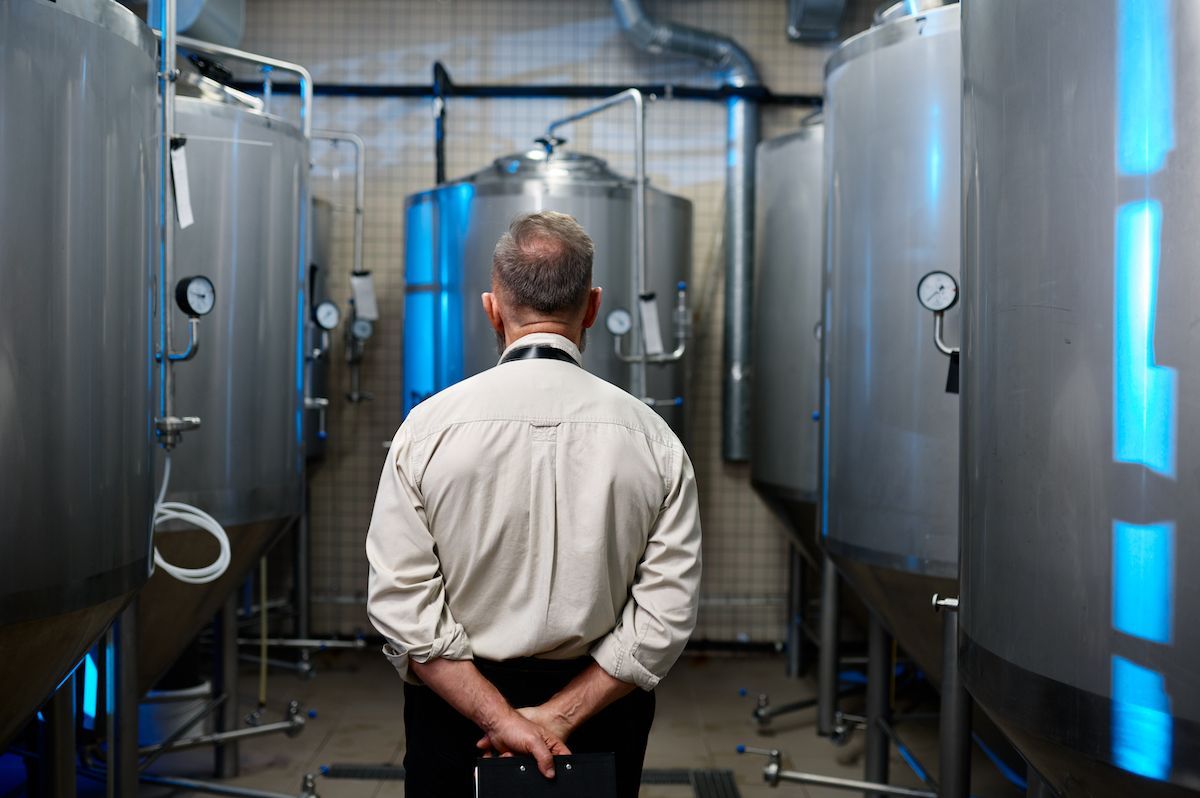 A brewery looking at his equipment while he ponders growth options