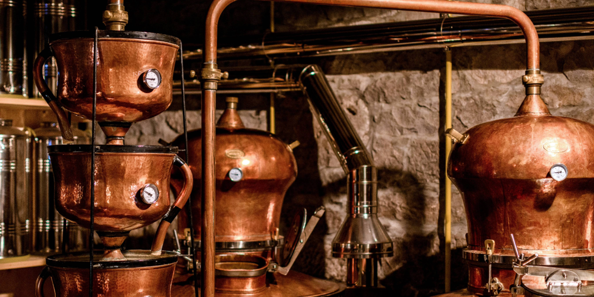 Copper still at a distillery 