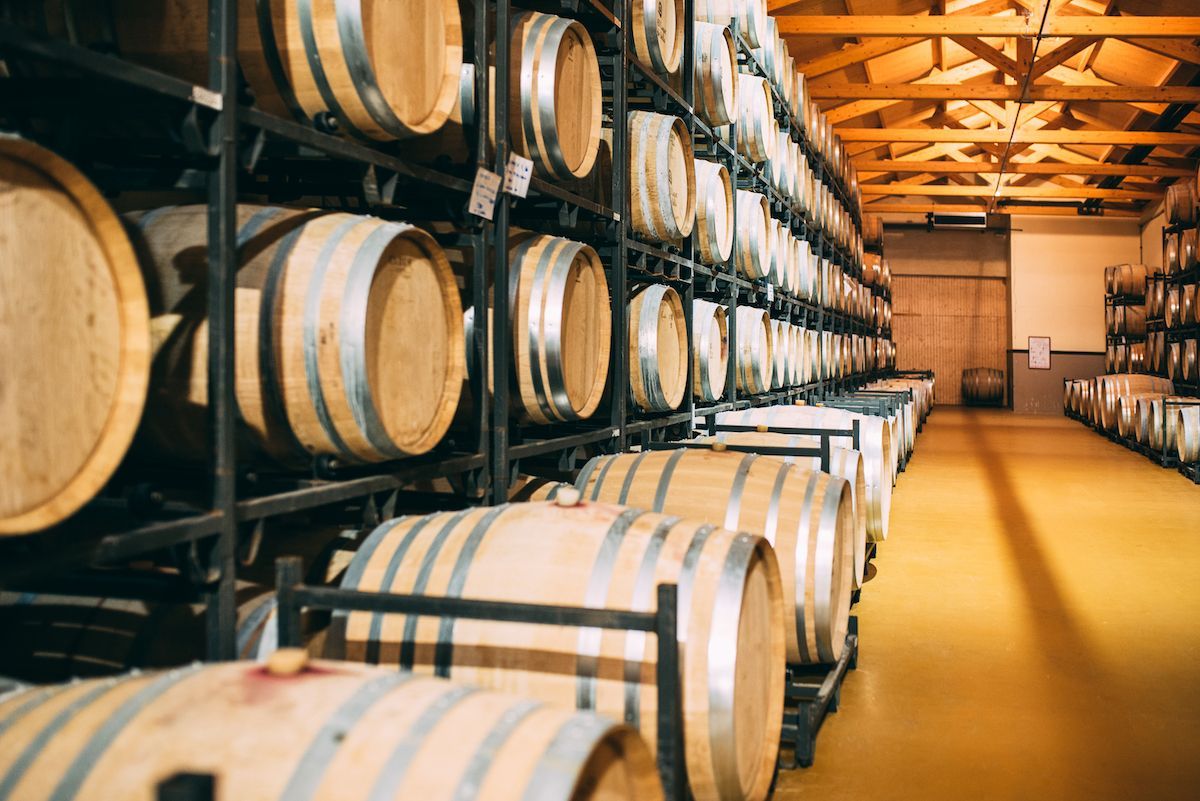 Wine stored in wooden barrels at winery