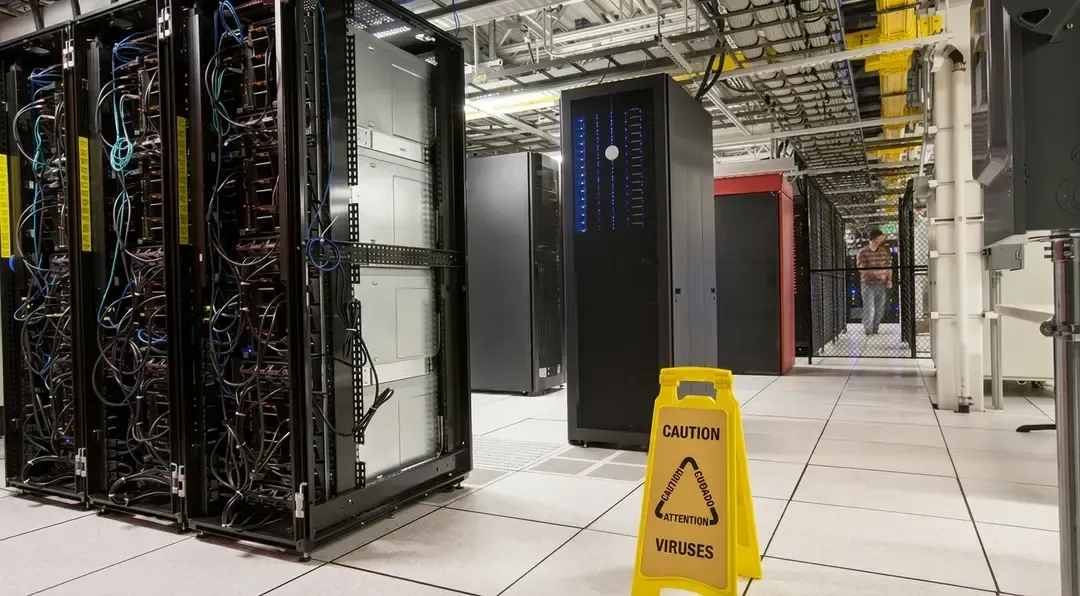 Racks of servers aligned in rows in a large computer server farm