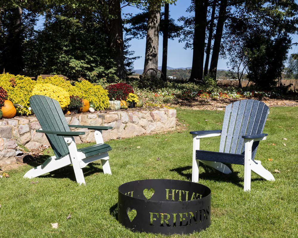 Two chairs are sitting next to a fire pit that says friends