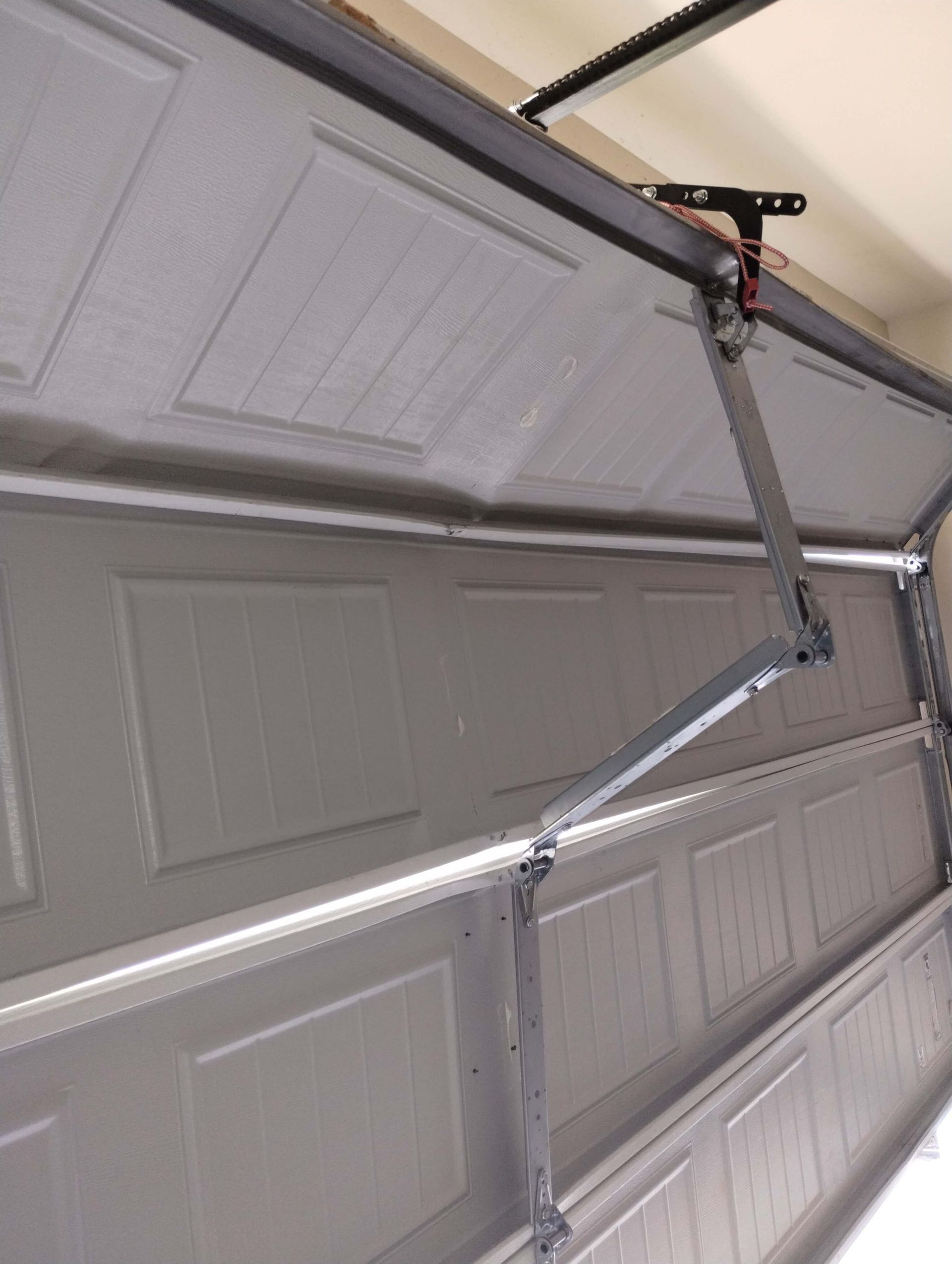 A close up of a garage door with the door open.