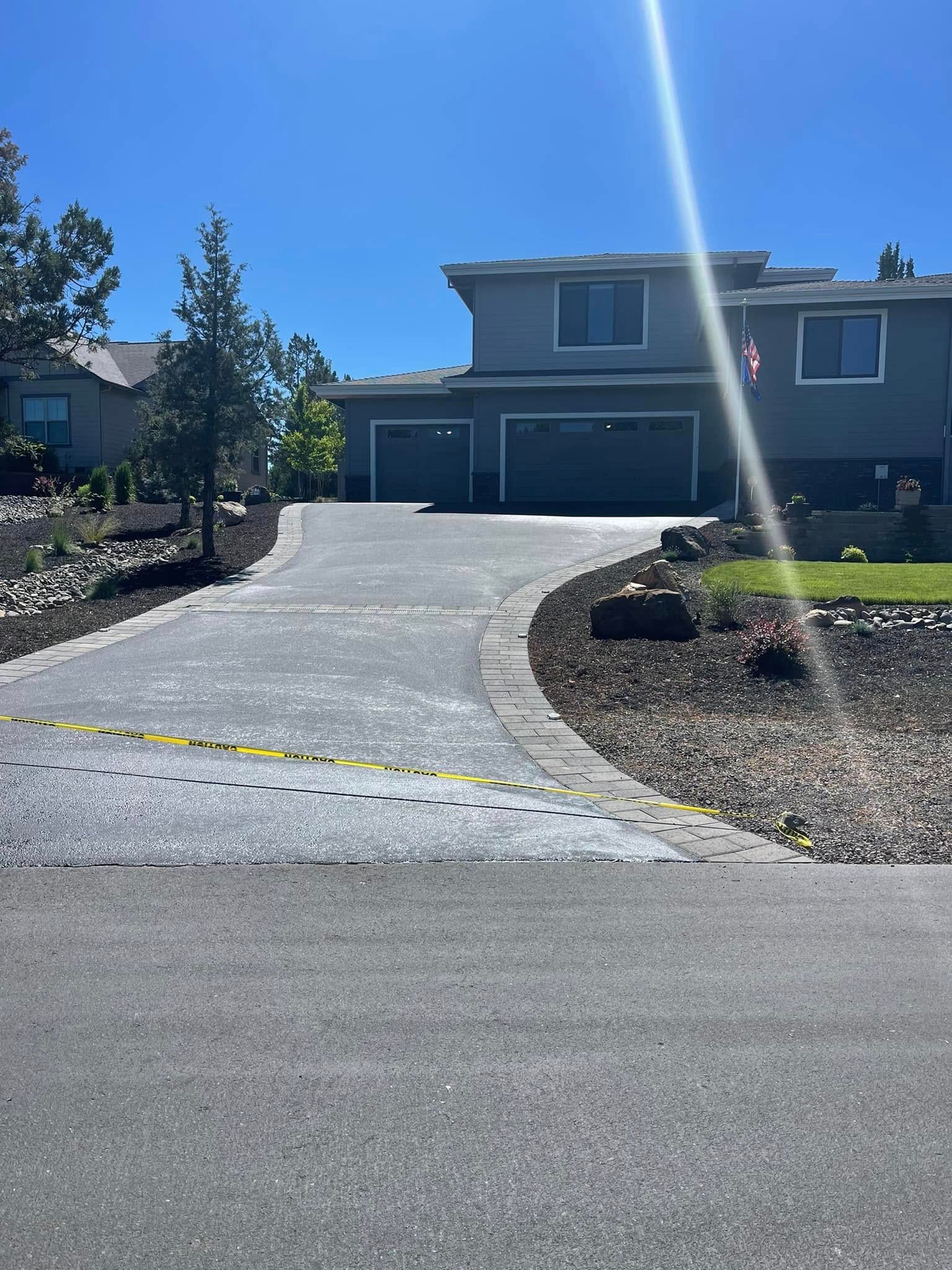 A large house with a driveway leading up to it.