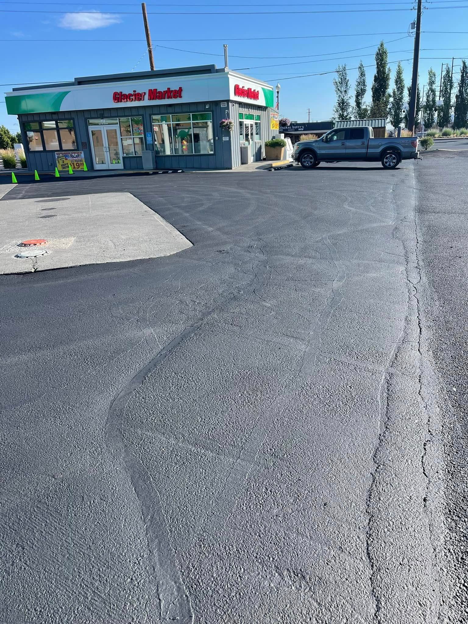 A car is parked in front of a building on the side of the road.