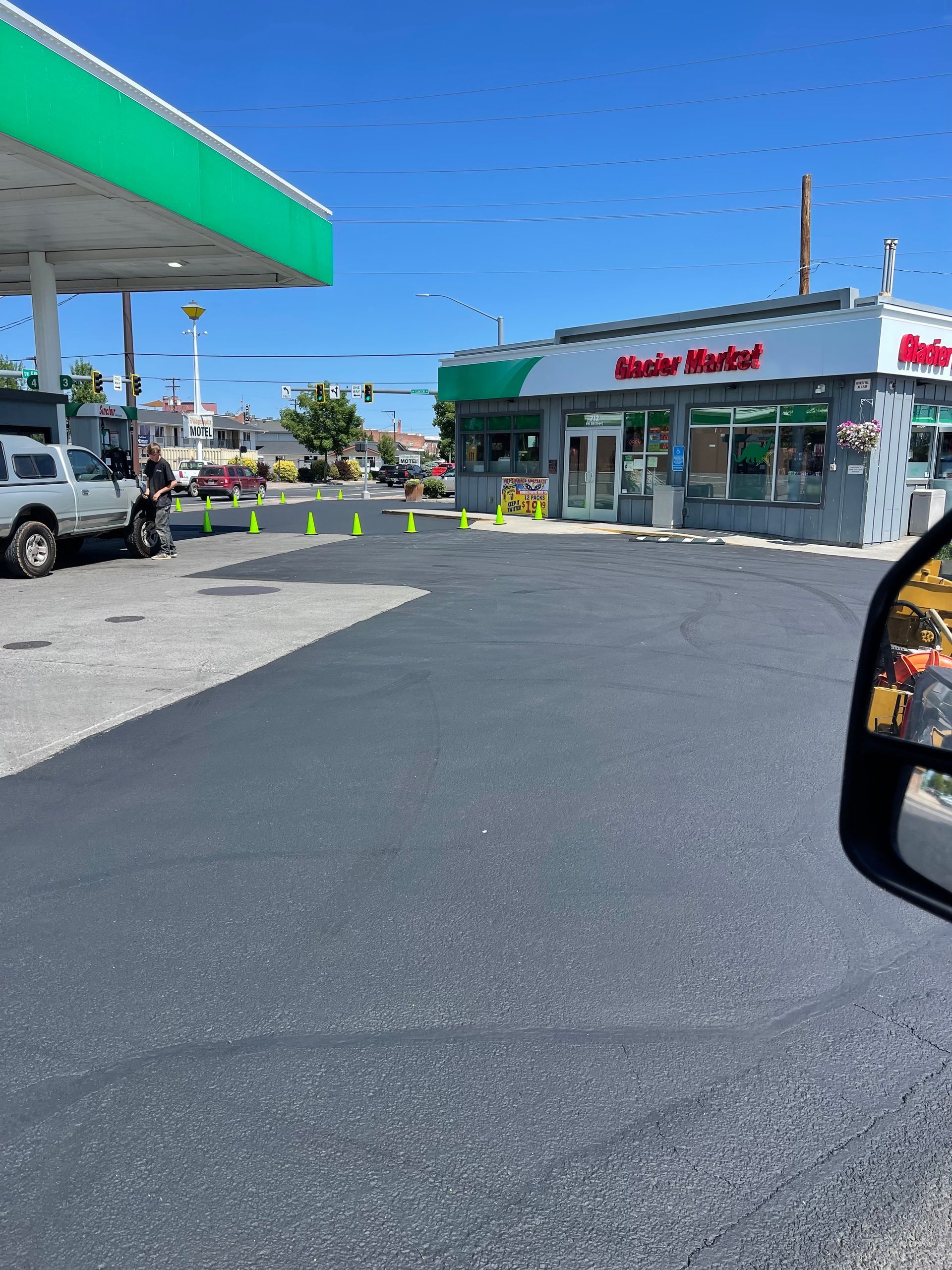 A car is parked in front of a gas station