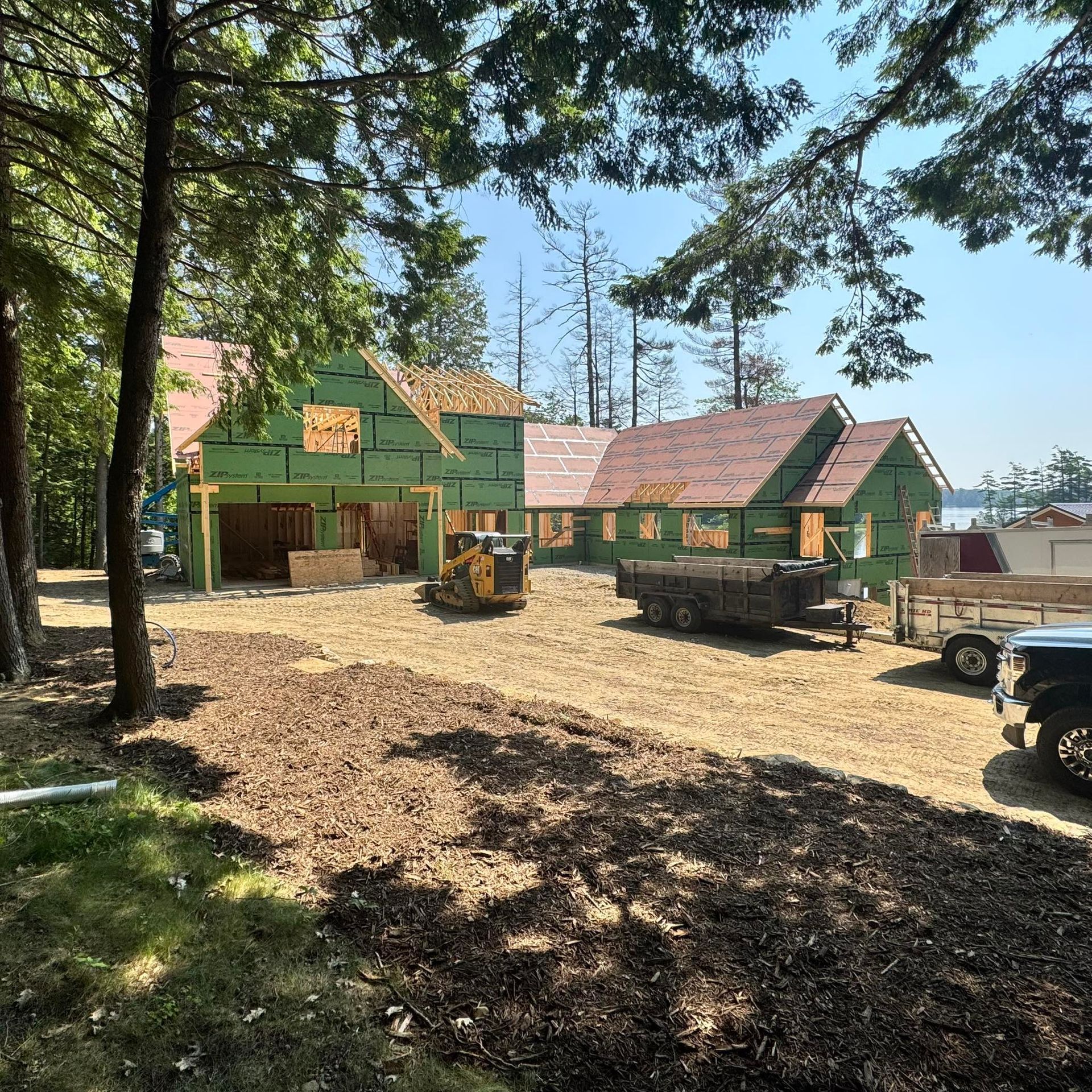 A house is being built in the middle of a dirt field.