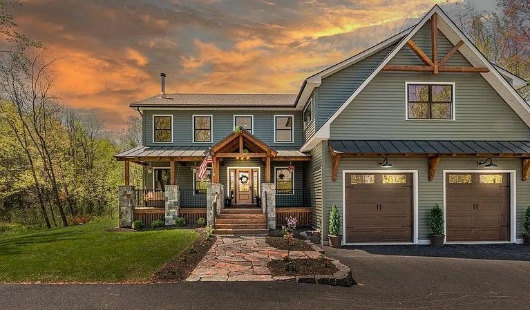 Boats are docked in a harbor with a city in the background