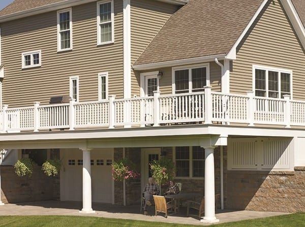 A house with a large porch and a white railing