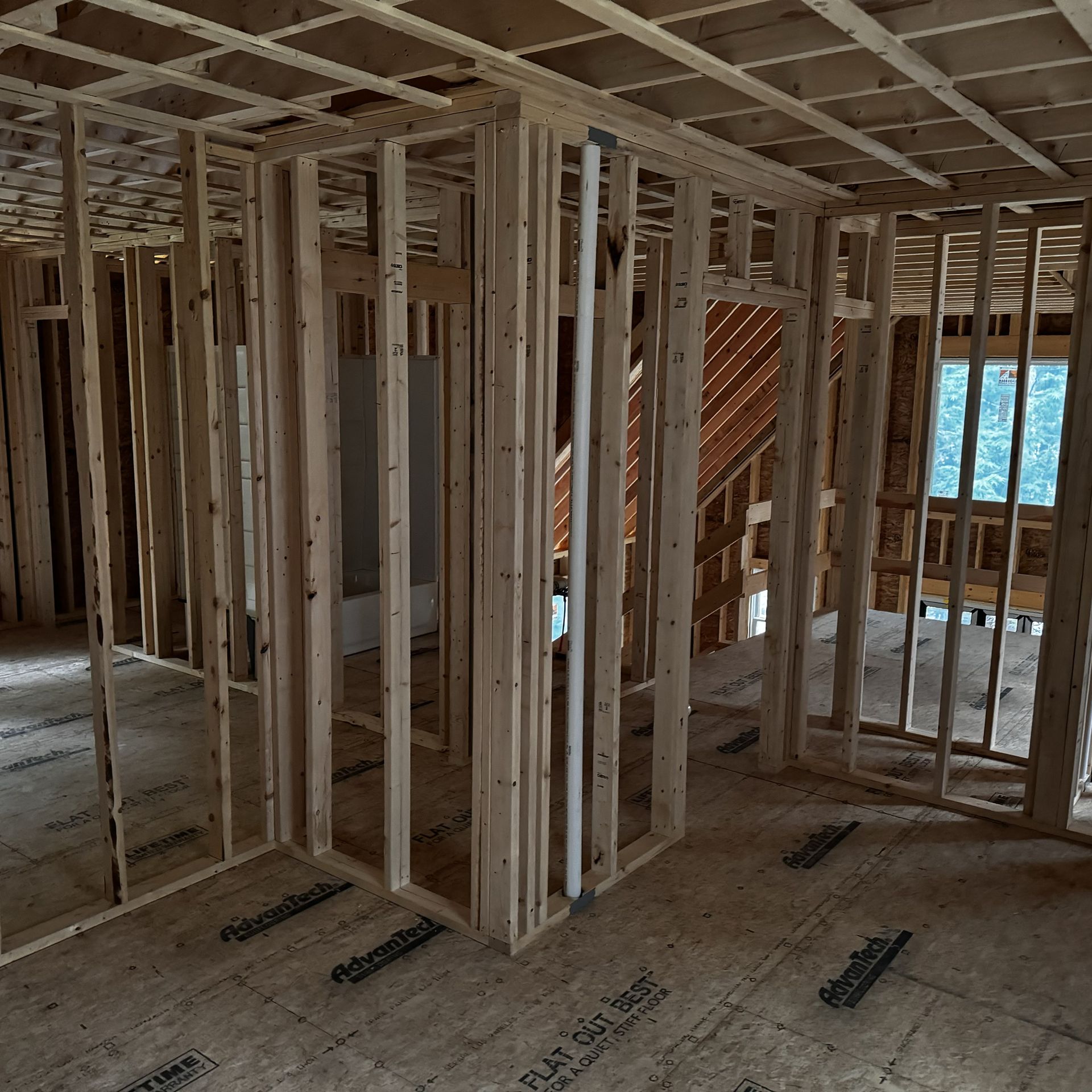 A house is being built with a lot of wooden frames