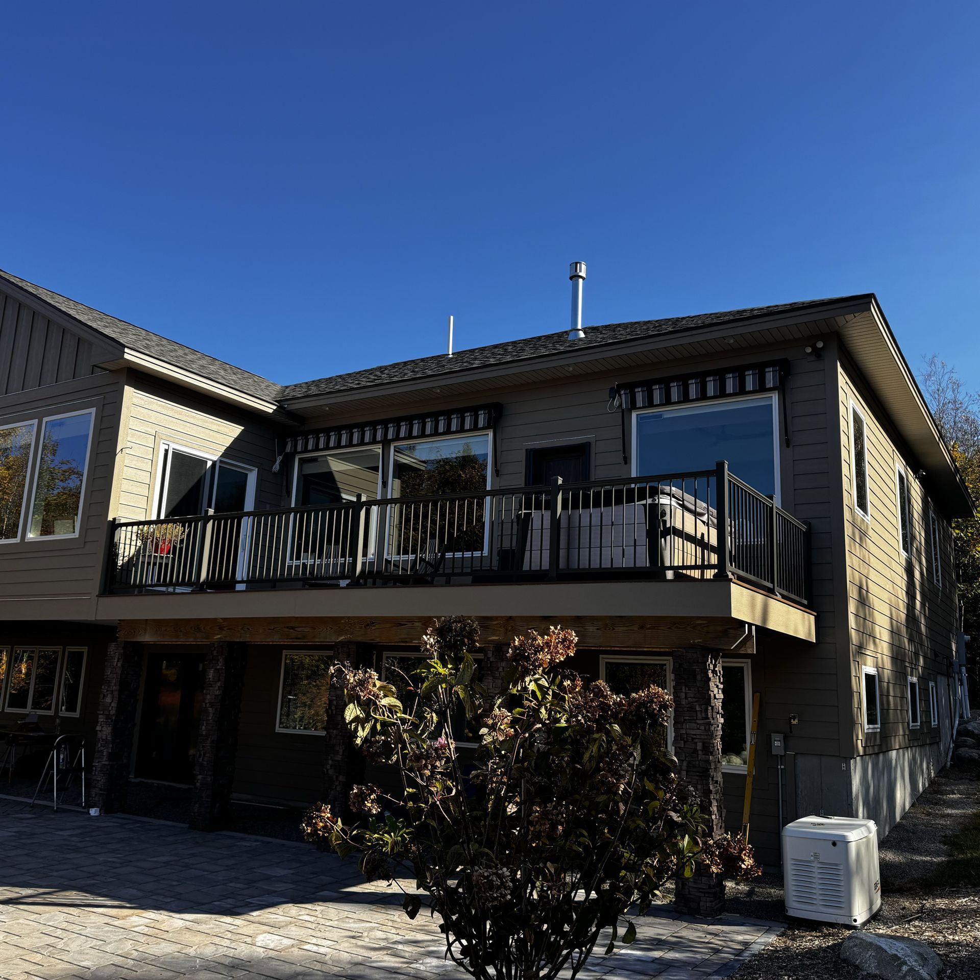 A large house with a balcony and a lot of windows