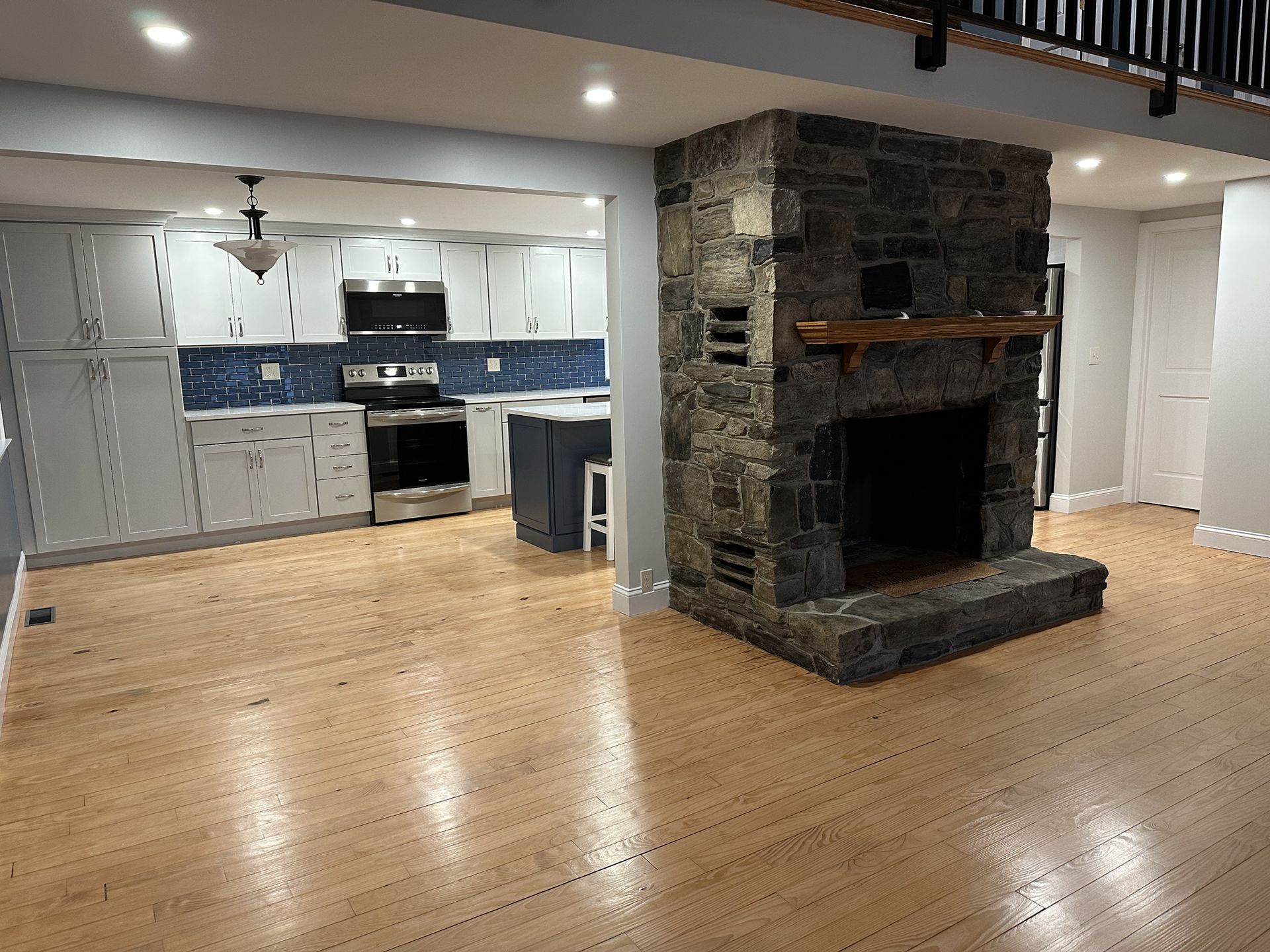 There is a fireplace in the middle of the room.