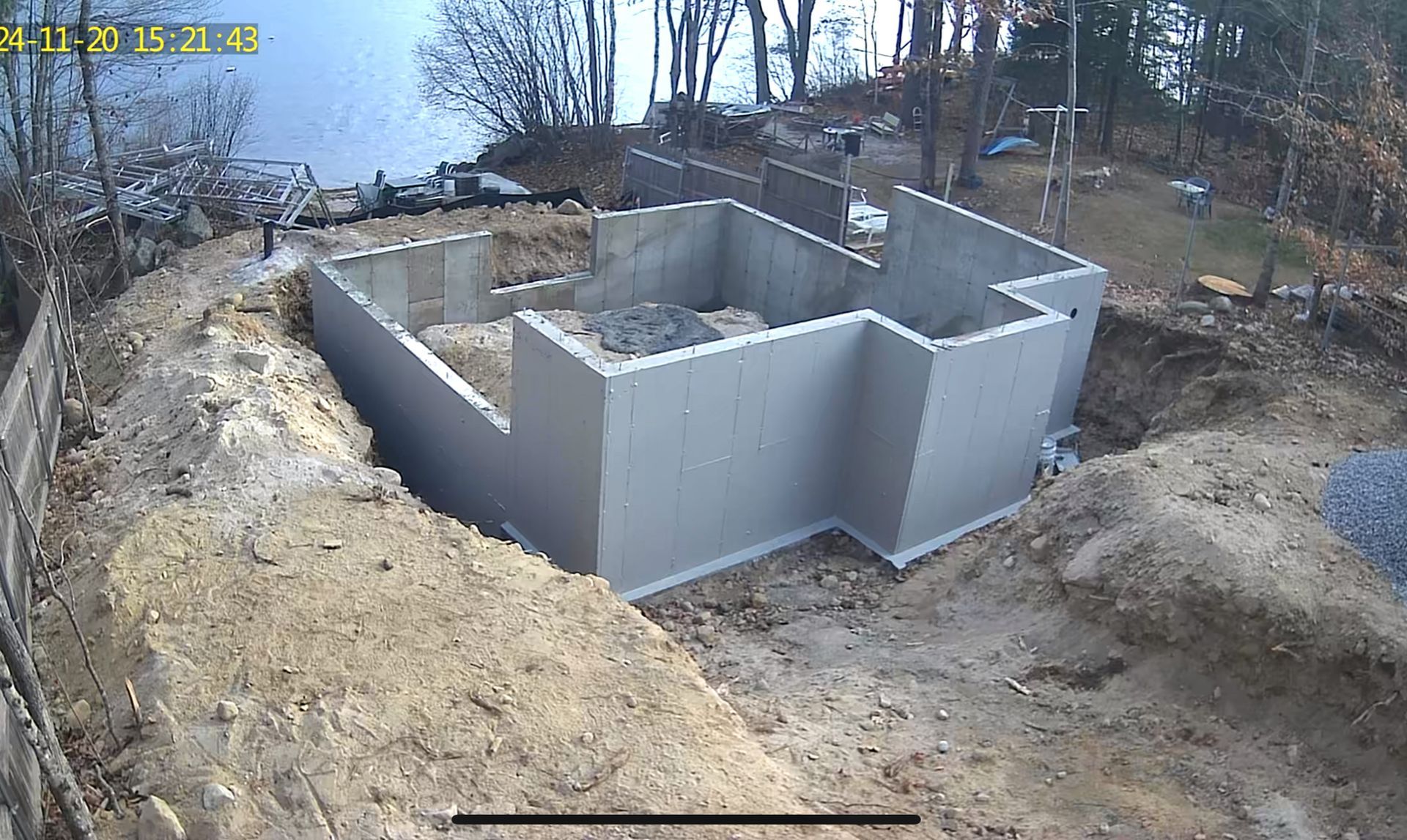 A concrete basement is being built next to a body of water