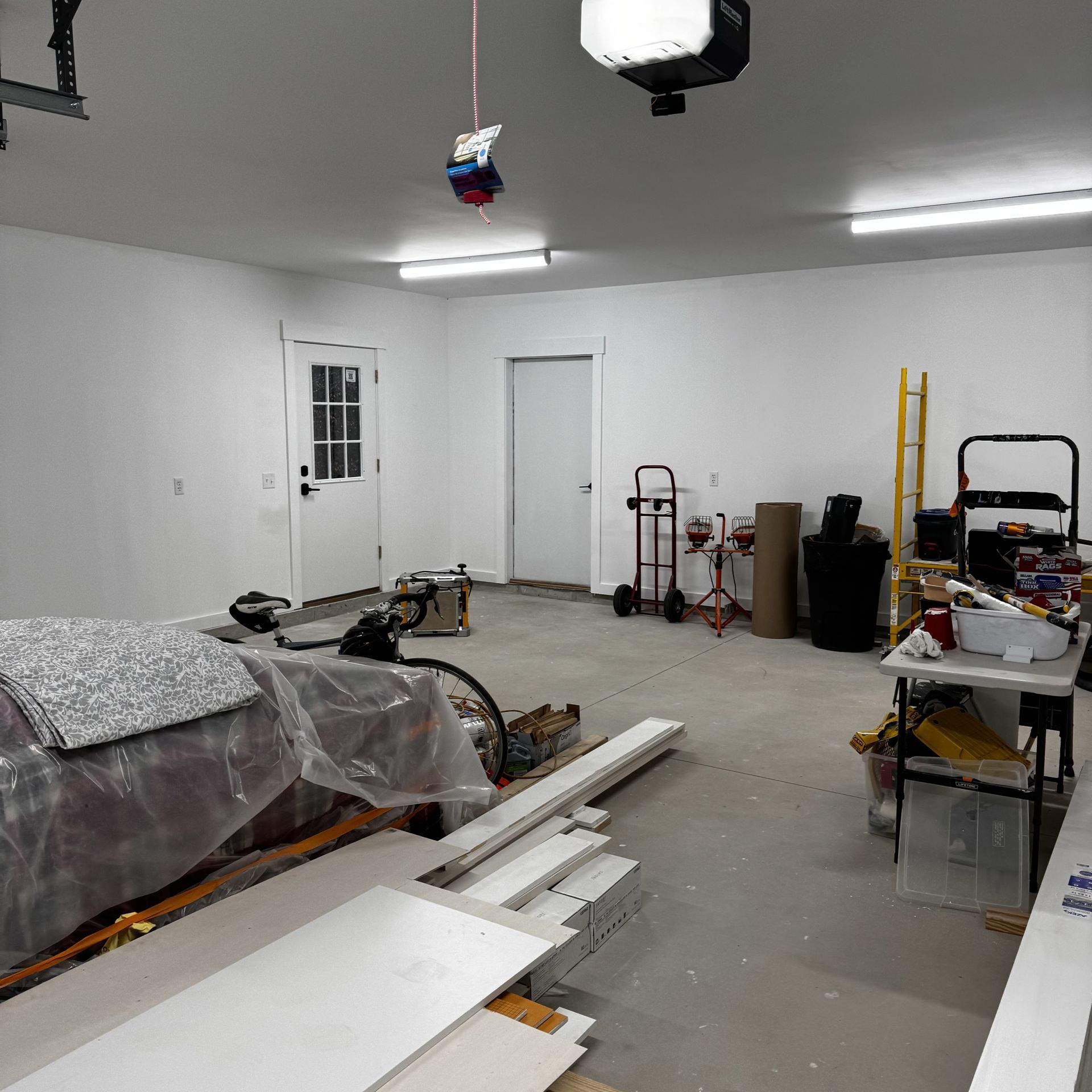 A garage with a couch and a table in it