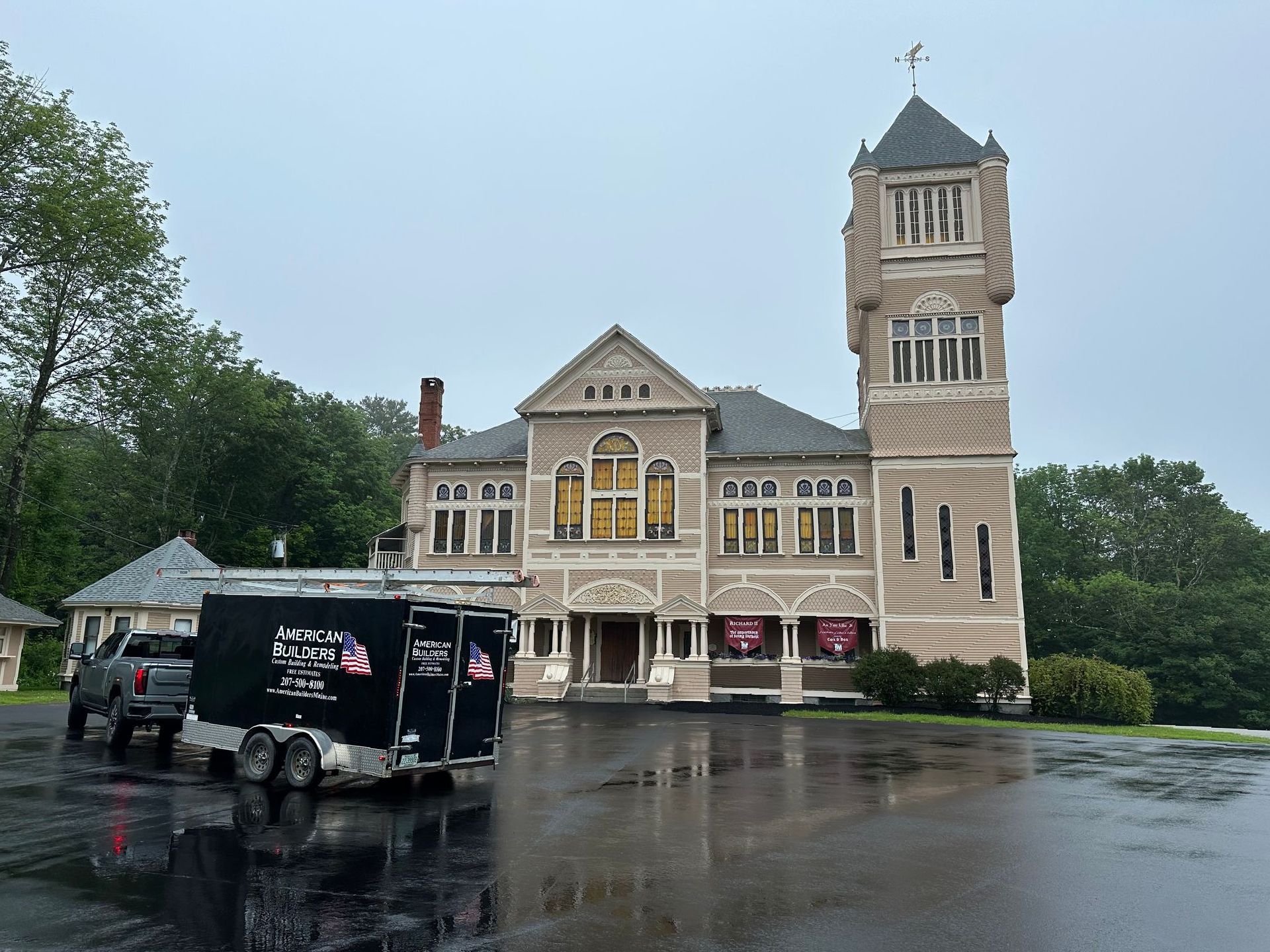 A large white house with a gray metal roof