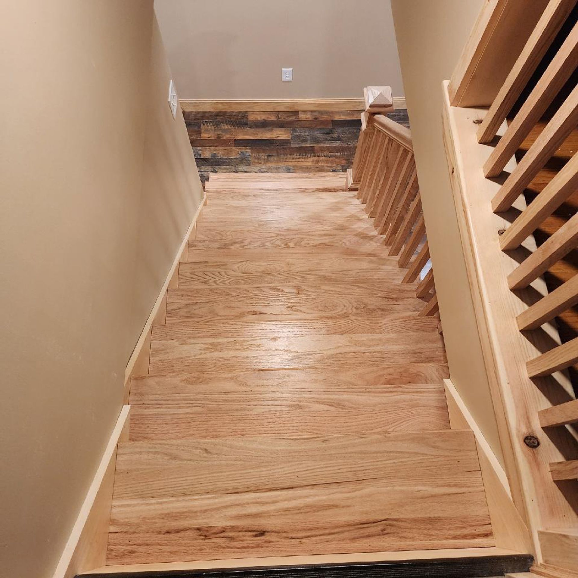 A wooden staircase leading up to the second floor of a house